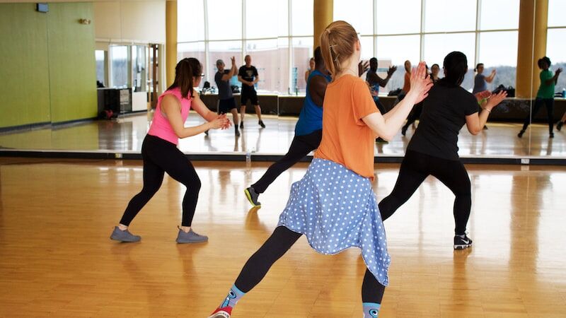 Women are training in aerobics